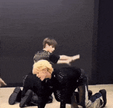 a couple of people are doing a dance on the floor .