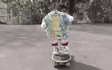 a deer is riding a skateboard on a street
