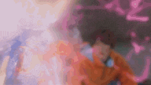 a blurred image of a person in an orange jacket