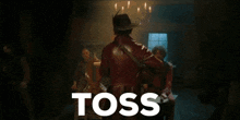 a man in a cowboy hat is dancing in front of a sign that says " the sauceee "