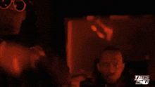 a blurred image of a person with the words this 50 on the bottom right
