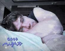 a man is laying on a bed with the words good night written on the bottom