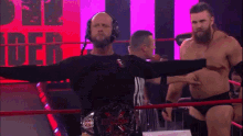 two men in a wrestling ring with the word impact on the wall