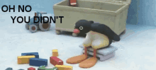 a stuffed penguin is sitting on a pile of blocks with the words oh no you didn 't written on the bottom