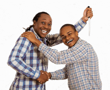 a man is holding a knife over another man 's shoulder