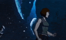 a man is holding a bow and arrow in a dark room .