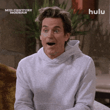 a man with a surprised look on his face is featured in an ad for mid century modern on hulu