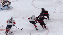 a hockey player with the number 37 on the back of his shirt
