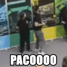 a blurred image of a person playing a video game with the words pac00000 written below them