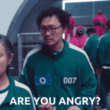 a man in a green jacket with the number 007 on it says are you angry