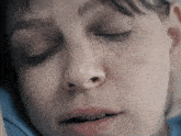 a close up of a woman 's face with a stitch on her eye