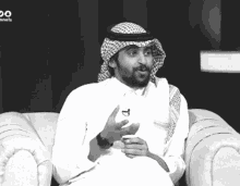 a man is sitting on a couch with the word channels on the bottom