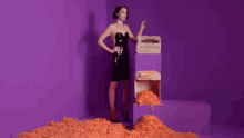paper shredder orange sheets big no paper messsage purple backdrop