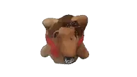 a close up of a stuffed animal with a red collar