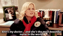 a woman is sitting at a desk talking about ann 's doctor