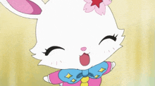 a white rabbit with a pink flower on its head is smiling