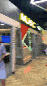 a blurry picture of a restaurant with a sign that says ' mrs. '