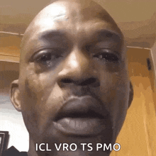 a close up of a man 's face with tears running down his face and the words icl vro ts pmo .
