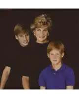 a woman is sitting with two boys on her shoulders