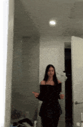 a woman taking a picture of herself in the mirror