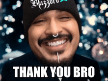 a man with a beard and nose ring is smiling with the words thank you bro written below him