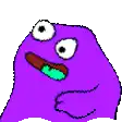 a green cartoon character with big eyes and a pink tongue sticking out .
