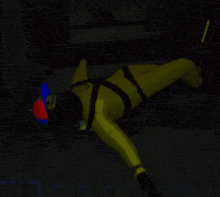 a man in a yellow suit is laying on the floor in a dark room