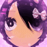a girl with a pink bow in her hair