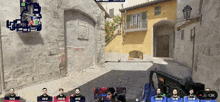 a group of men are playing a video game and one of them has the number 13k on his screen
