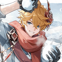a boy with a scarf around his neck holds a snowball