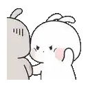 a couple of rabbits standing next to each other and hugging .