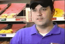 a man in a purple dunkin ' donuts uniform