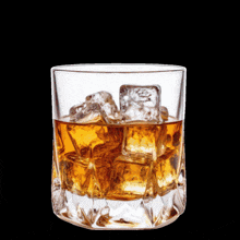 a man sitting at a table with a glass of whiskey and a prayer