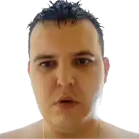 a man without a shirt is looking at the camera