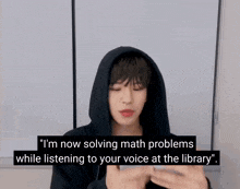 a man in a black hoodie is talking about math problems