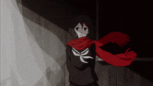 a girl with a red scarf around her neck stands in the dark