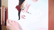 a person is drawing a woman 's face with colored pencils behind them
