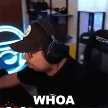 a man wearing headphones and a hat with the word whoa on the bottom