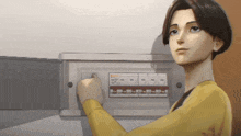 a woman in a yellow sweater is pressing a button on a box