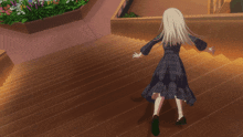 a girl in a plaid dress is walking down a set of stairs