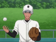 a baseball player is throwing a ball and wearing a hat with a bug on it
