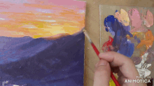 a person is painting a sunset on a canvas with the words made in animotica below them