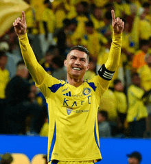 a soccer player wearing a yellow and blue shirt that says karf