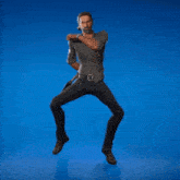 a man is dancing in front of a blue background