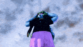 a woman in a purple skirt stands in front of a cloudy sky with her hands on her head