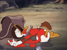 a cartoon character laying on the ground with blood coming out of his mouth