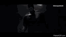 a close up of a person 's face in the dark on make a gif