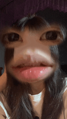 a close up of a woman 's face with pink lips