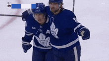 two toronto maple leafs hockey players are celebrating