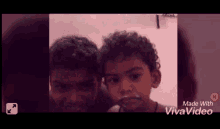 two young boys are standing next to each other and their faces are covered in food .